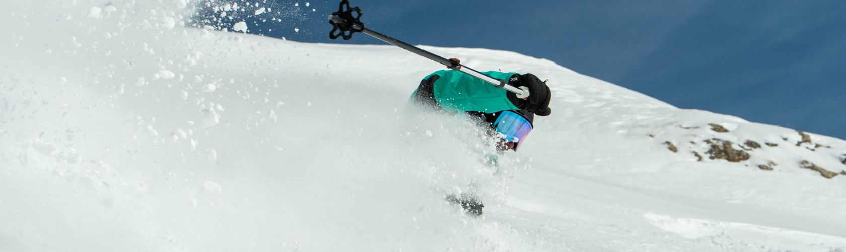 skier turning in powder